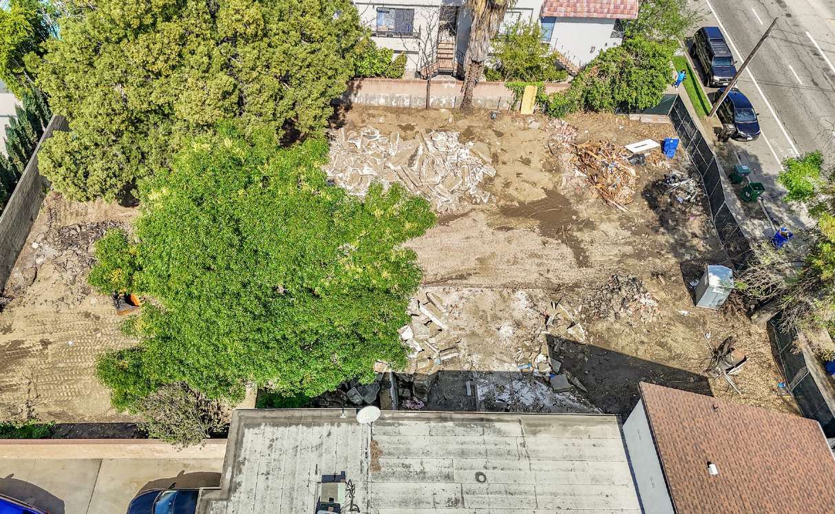 Top-down aerial of the cleared 10,005 SF lot